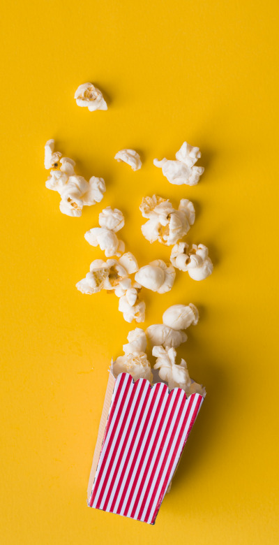 flat-lay-popcorn-yellow-background